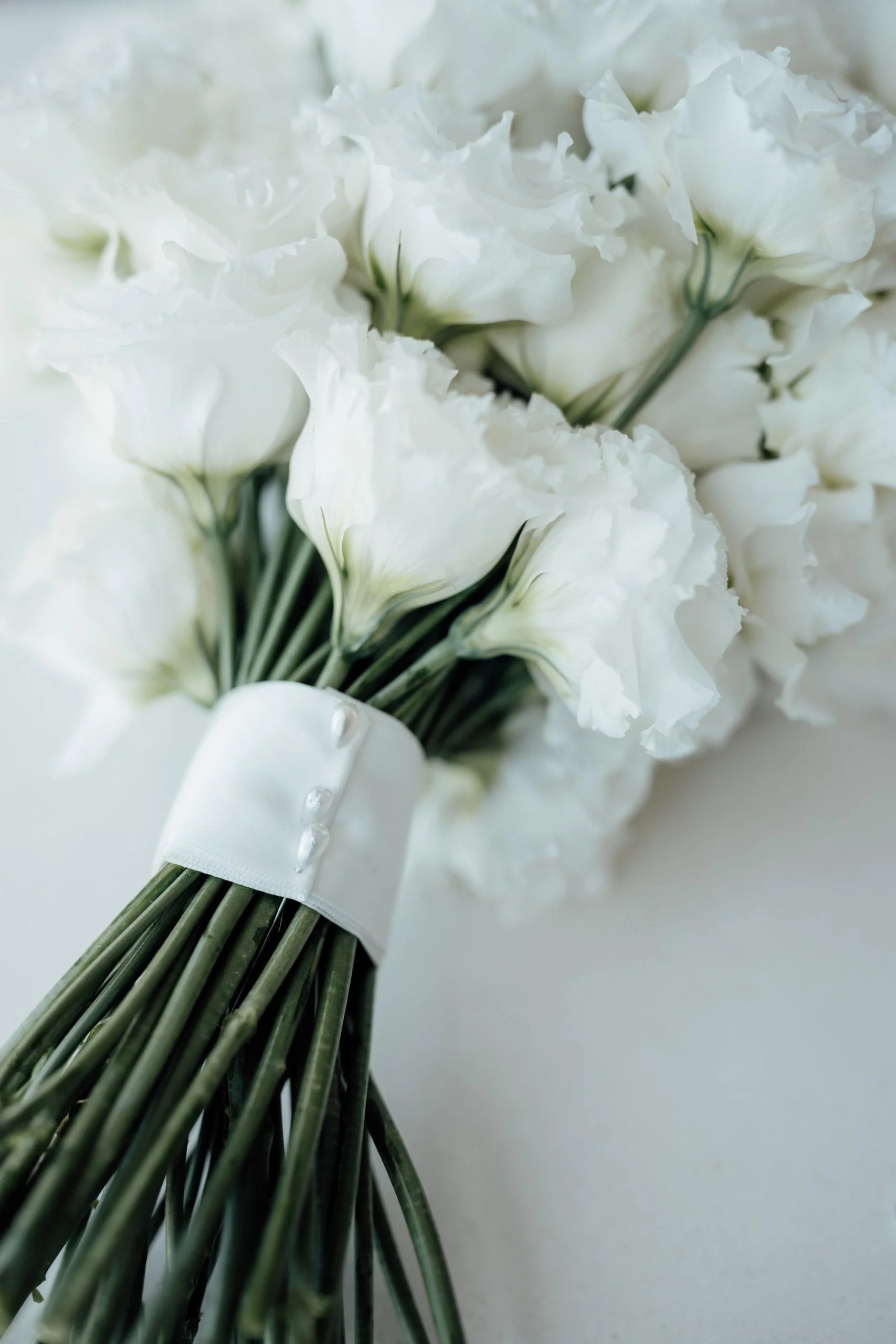 Sculptural bridal bouquet of white Lisianthus for modern wedding in the Swan Valley.