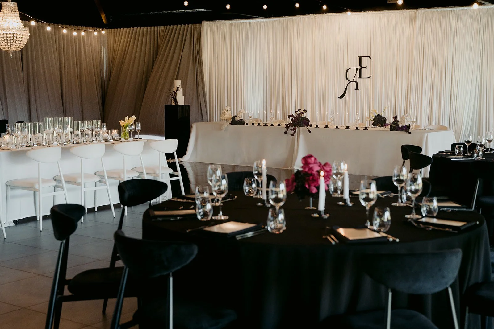 Nikola Estate Pavilion wedding reception styled with black, white, silver and deep purple details.