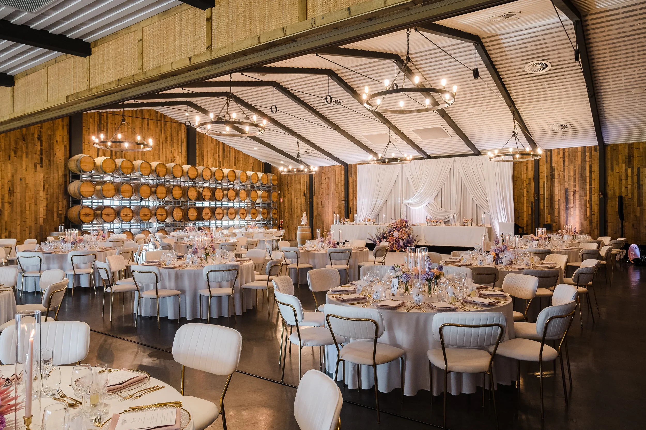 Pastel, elegant, romantic wedding reception styling at Sandalford Estate, white draped bridal table backdrop