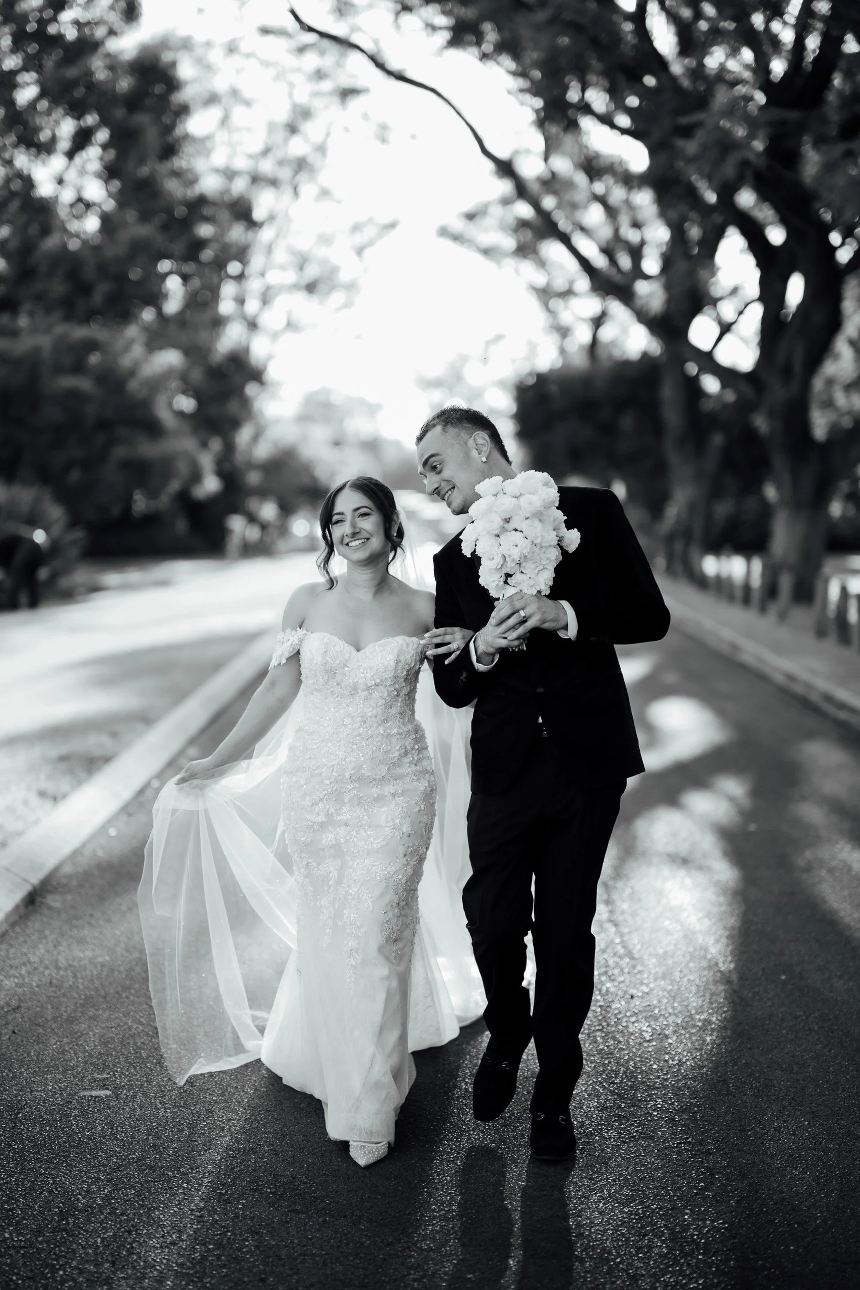 Bride and groom walking through the grounds at Nikola Estate in Perth's Swan Valley.