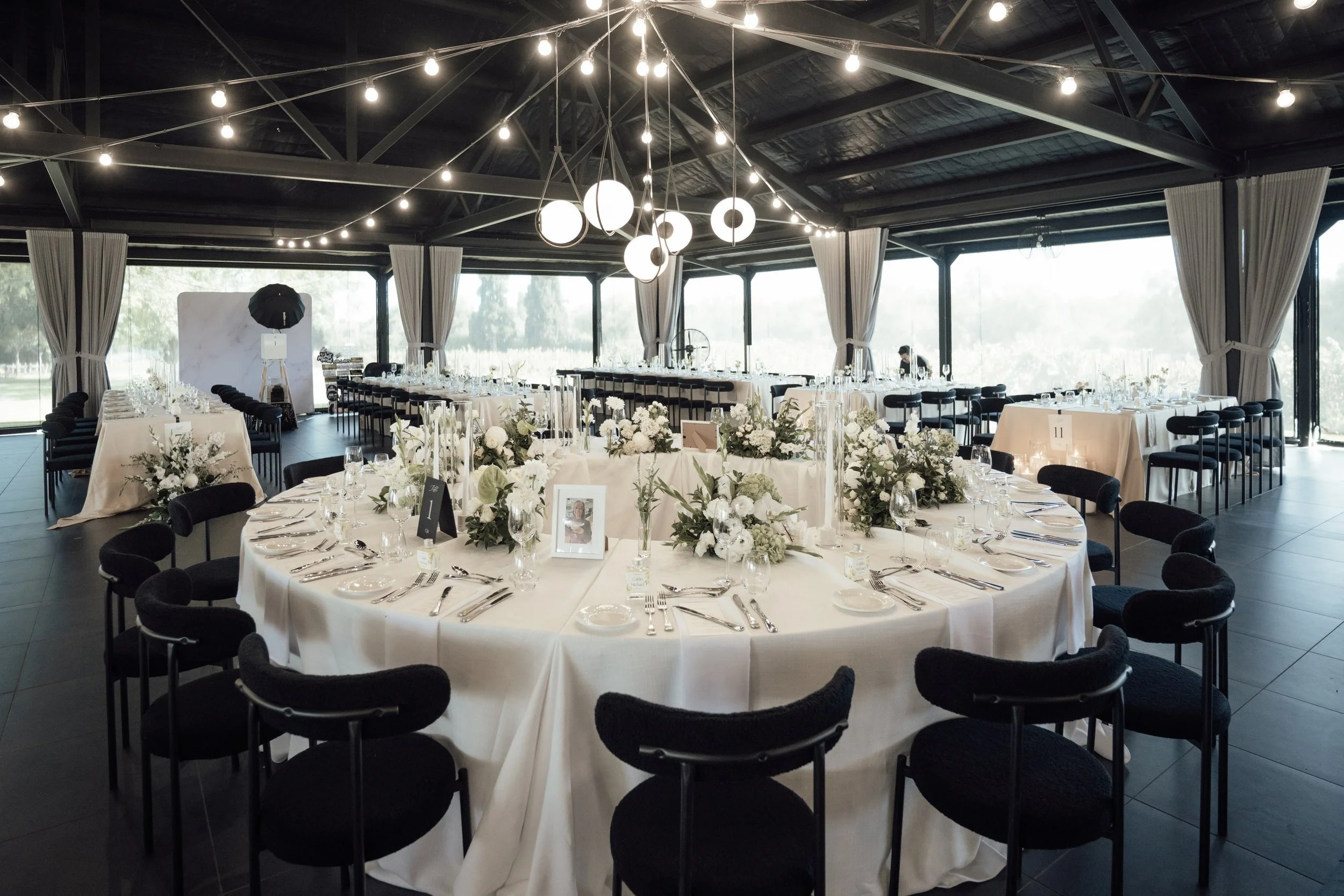 Modern circular bridal table designed as the focal point of the reception.