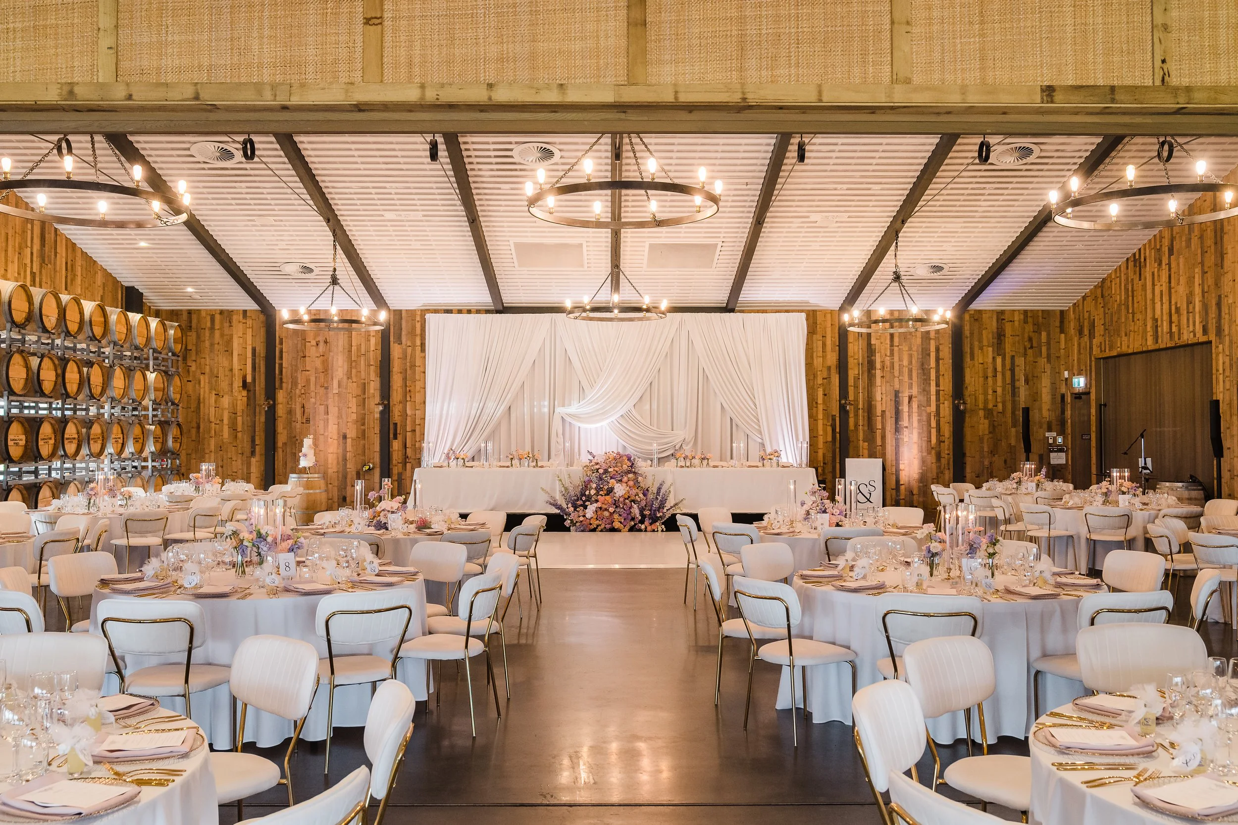 Pastel, elegant, romantic reception styling at Sandalford Estate, white draped bridal table backdrop