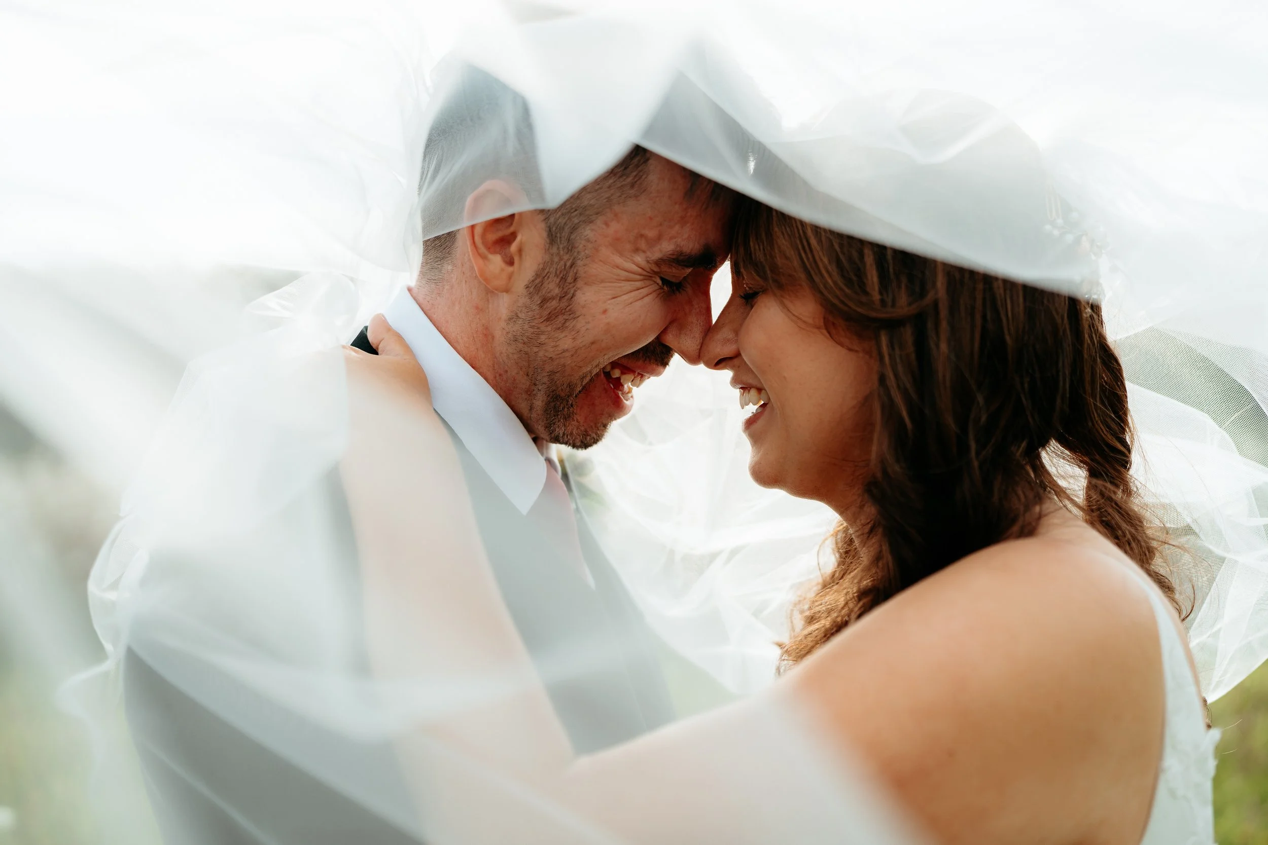 Auckland Wedding bride and groom under veil at Markovina