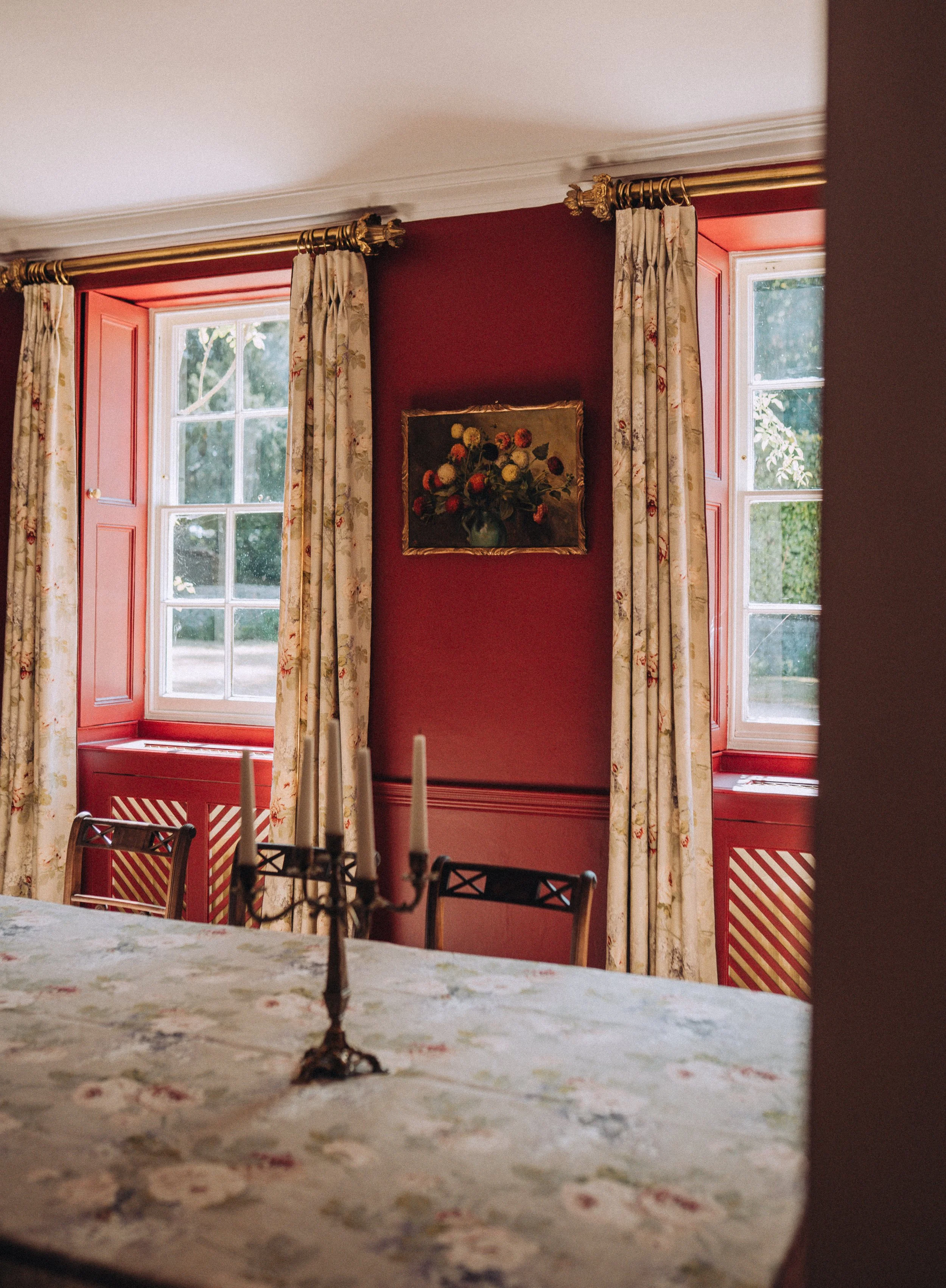 Red-walled dining room at Friars Well, Aynho