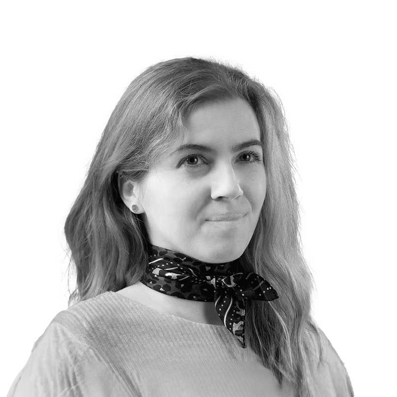 Black and white portrait of a young woman with long dark hair, wearing a black shirt, looking at the camera with a slight smile