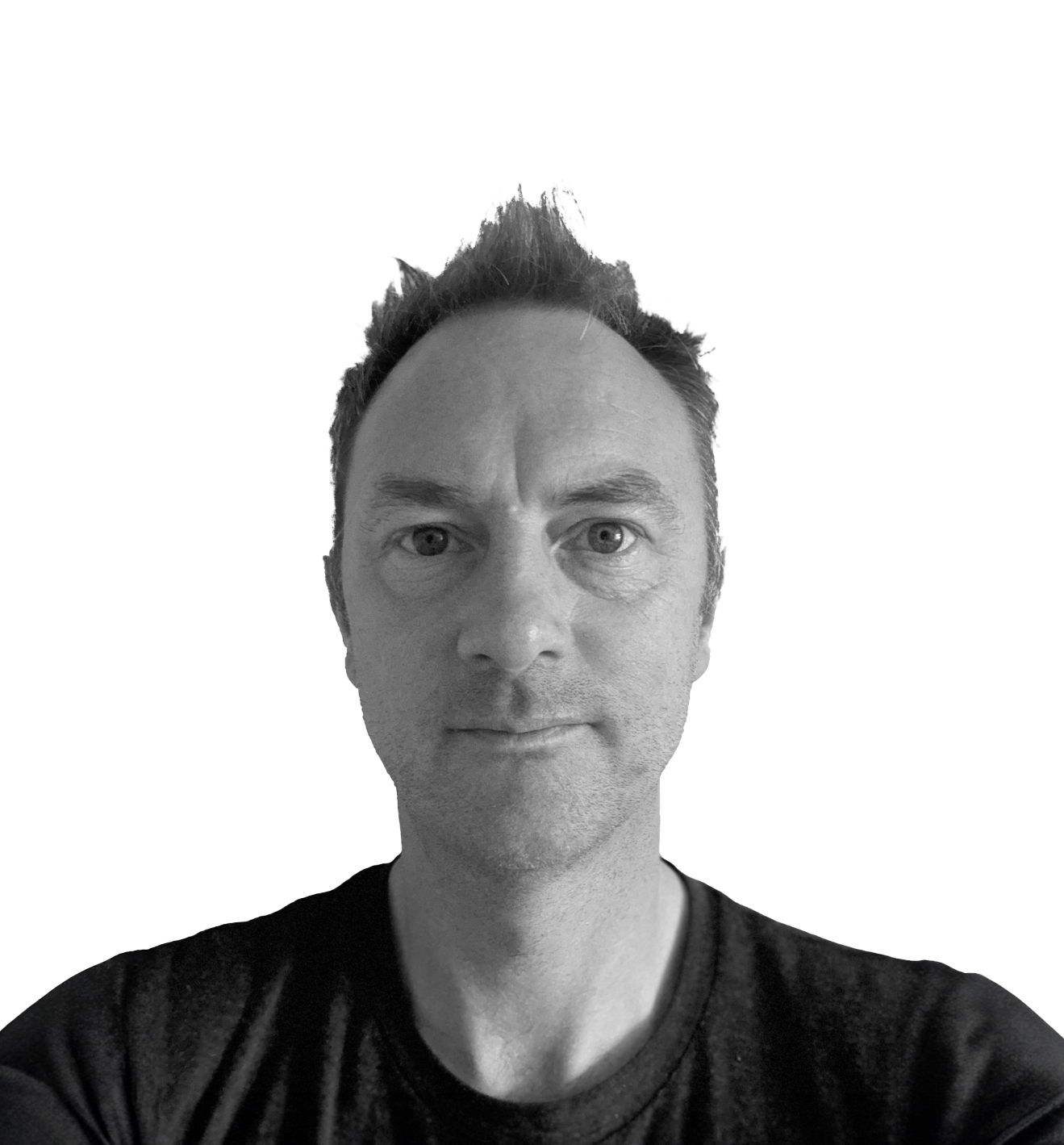 Black and white portrait of a man with short hair, wearing a dark shirt, looking directly at the camera.