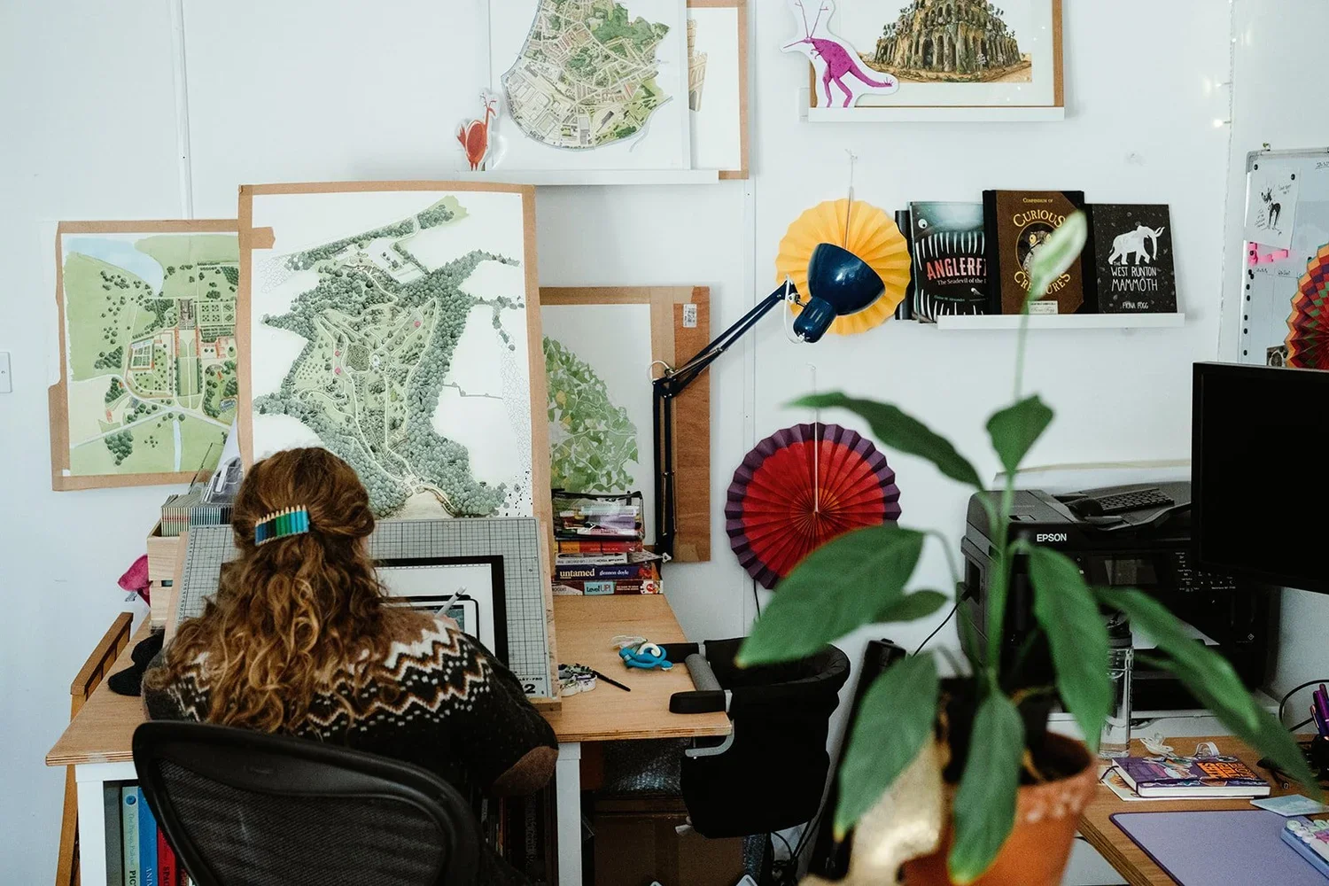 People drawing on whiteboards during a training session at JRM, Poringland, Norwich.