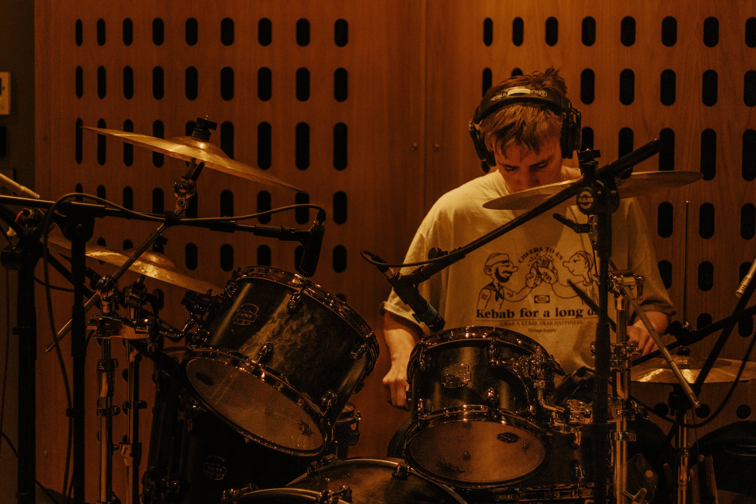 Groove in the Making: Witness the rhythmic essence of music coming to life during a drum recording session. Our lens captures the precision and passion that goes into every beat. Step into the heart of the music-making process with us.