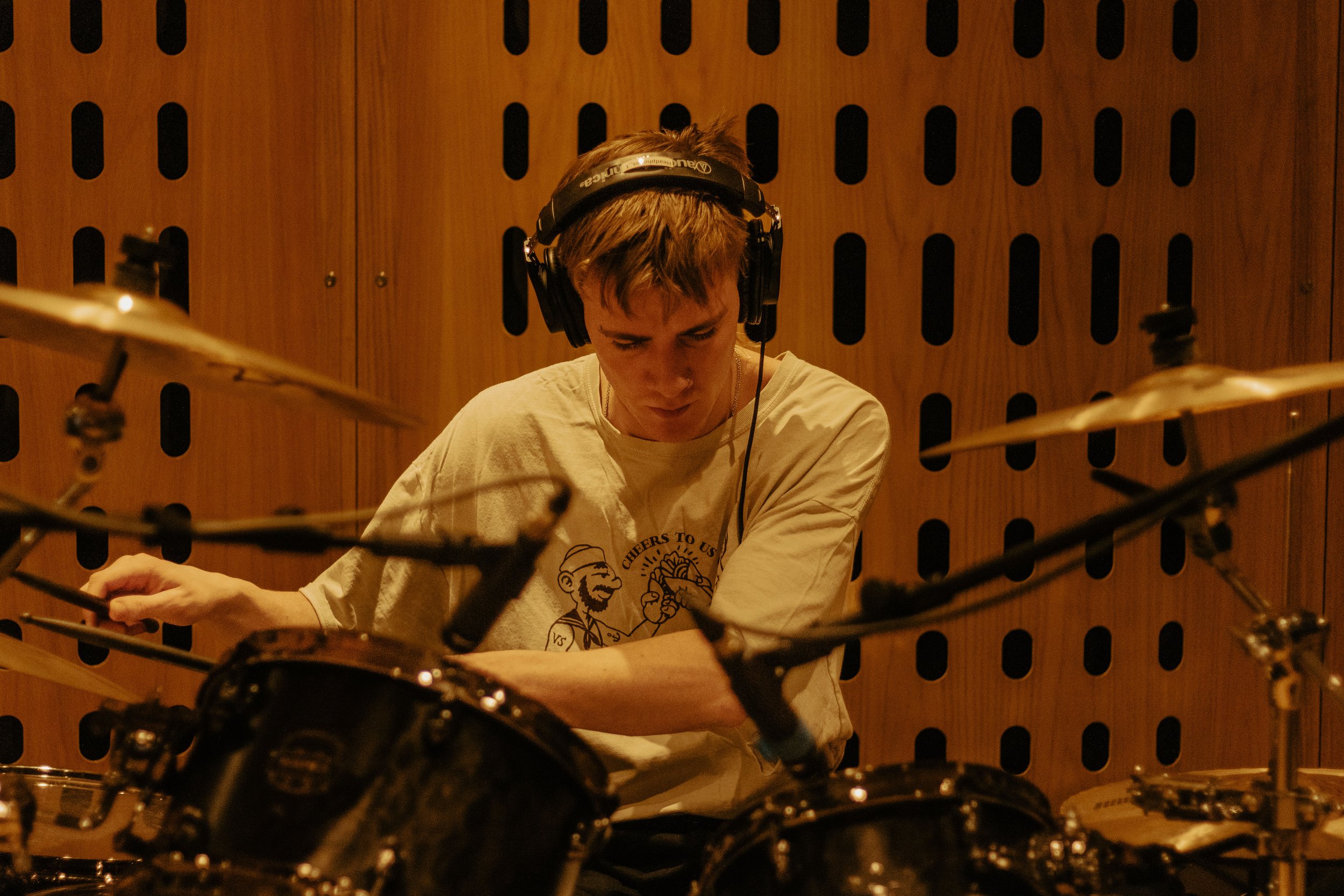 Groove in the Making: Witness the rhythmic essence of music coming to life during a drum recording session. Our lens captures the precision and passion that goes into every beat. Step into the heart of the music-making process with us.