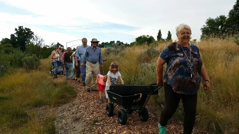 Volunteer Bonnie Hay sings along the trail.jpg
