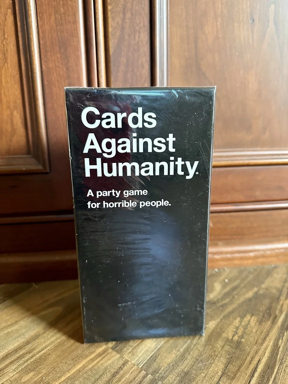 $10 — Cards Against Humanity, sealed in cellophane | sells currently for $30 on Amazon