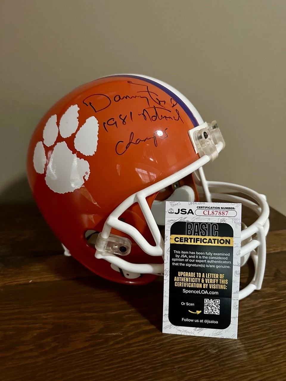 $325 | Signed Clemson Helmet – Danny Ford “1981 National Champs” (JSA Certified) | Full-size Clemson helmet signed by legendary coach Danny Ford, commemorating the 1981 National Championship. Includes JSA Basic Certification (card included). Signatur