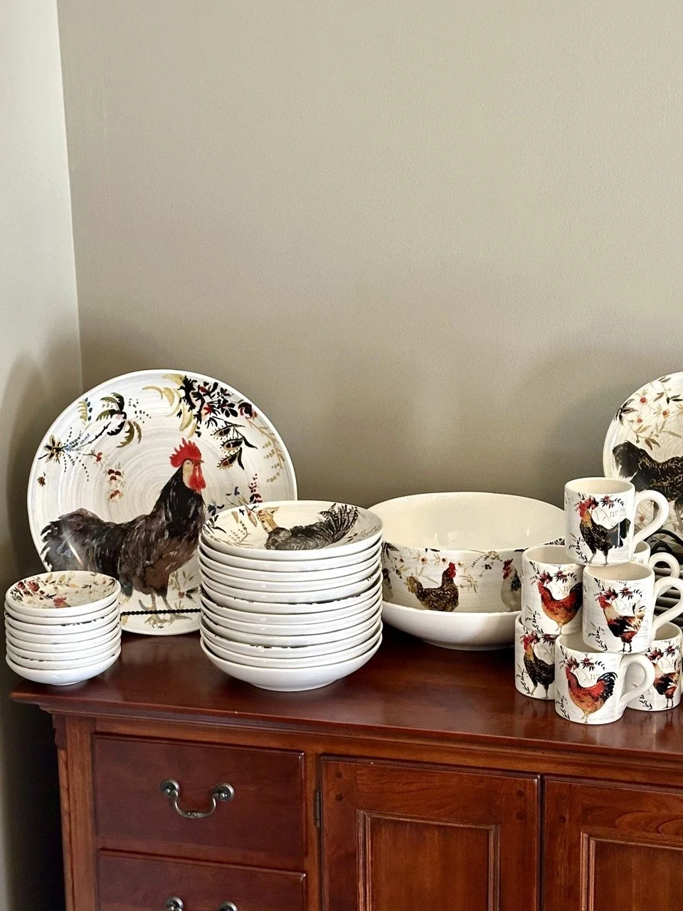 SOLD OUT - Use the arrows to browse a rooster kitchen collection — dishes, serving pieces, and coordinating décor.