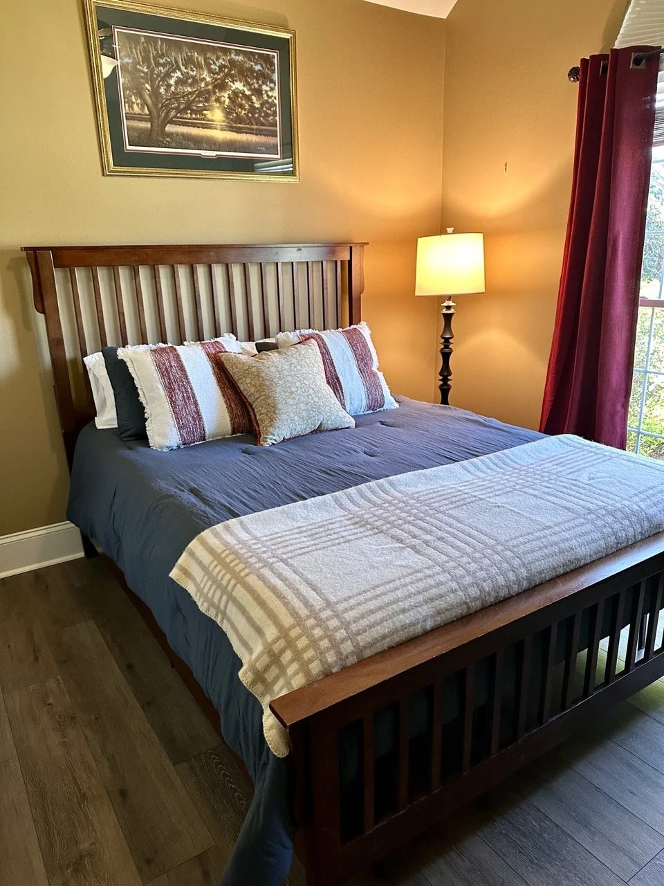 $200 • Solid Wood Queen Bed Frame • Slat-style headboard (55.5” H) with footboard and rails. 64.5” W x 85” L. Excellent condition.