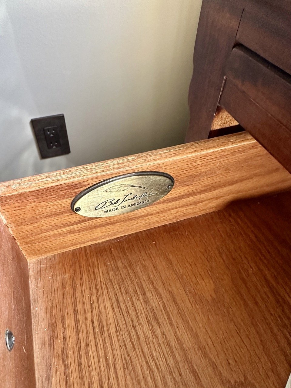 Everything in this primary bedroom collection is Bob Timberlake. Each piece has this medallion inside the top left drawer.