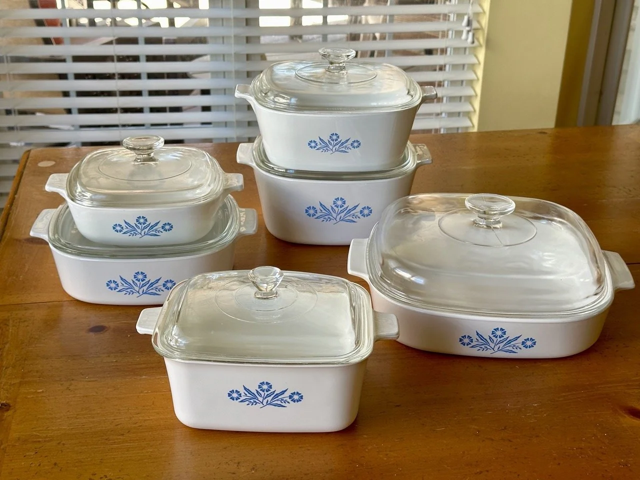 $85 - Vintage CorningWare Blue Cornflower Set w/ Pyrex Lids (6 Pieces, USA Made) • Classic oven-safe CorningWare set in the iconic Blue Cornflower pattern. Includes multiple sizes with original Pyrex glass lids. Made in USA, durable and versatile for