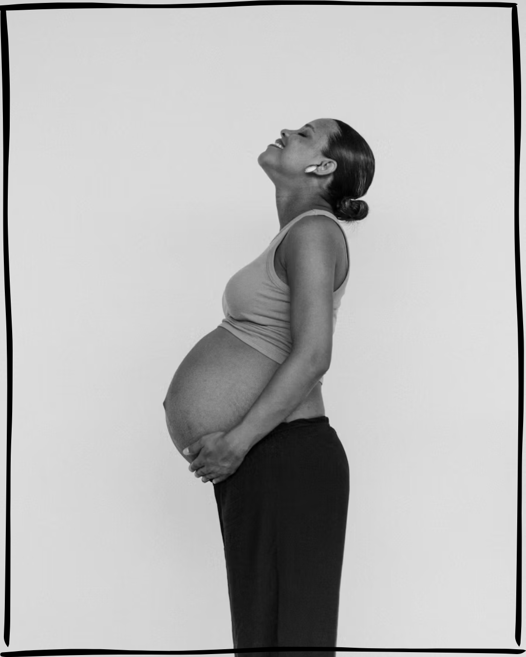 Pregnant woman in profile, black and white