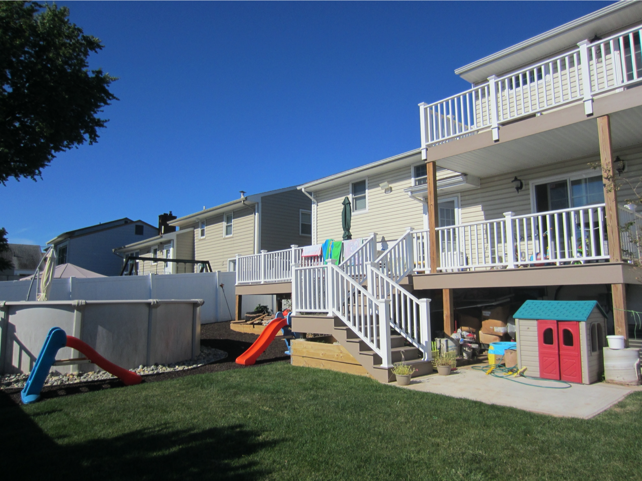 Second floor balcony and first floor decks at rear of house