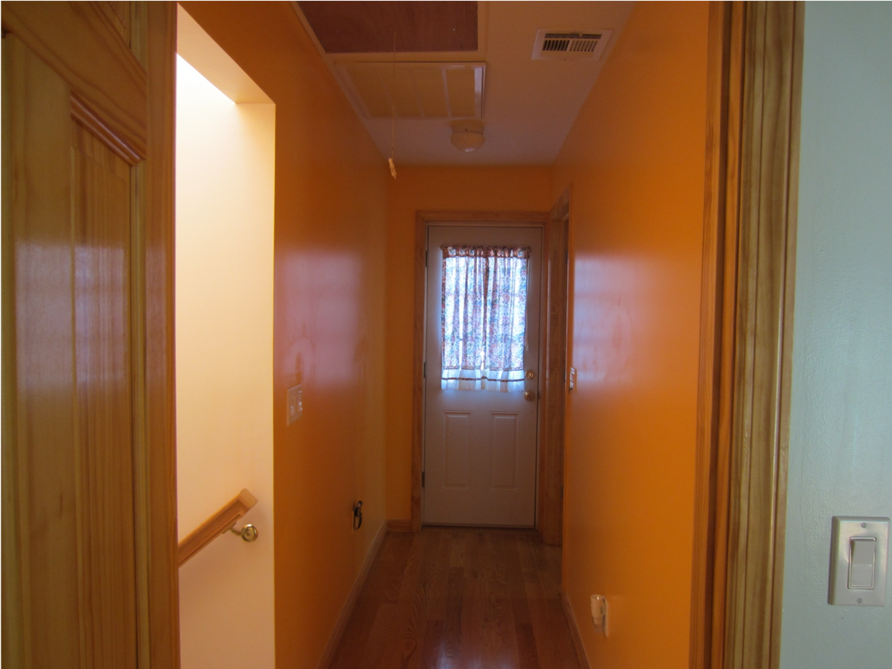 Corridor of new addition leading to new balcony at front of house