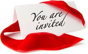 Invitation card with red ribbon and a red cloth piece.