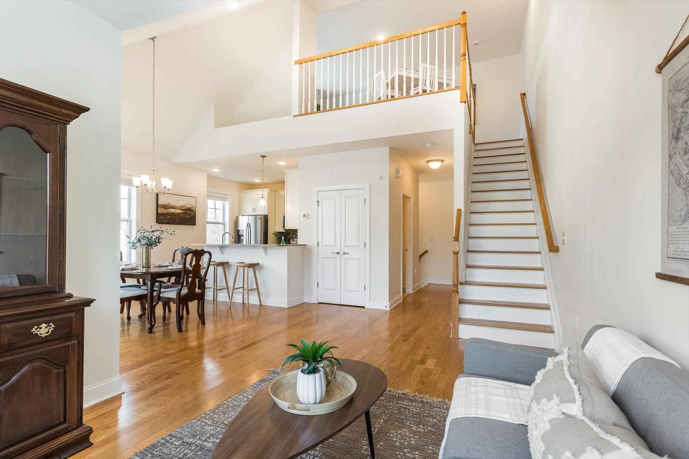 22-Living, Dining and Stairway.jpg