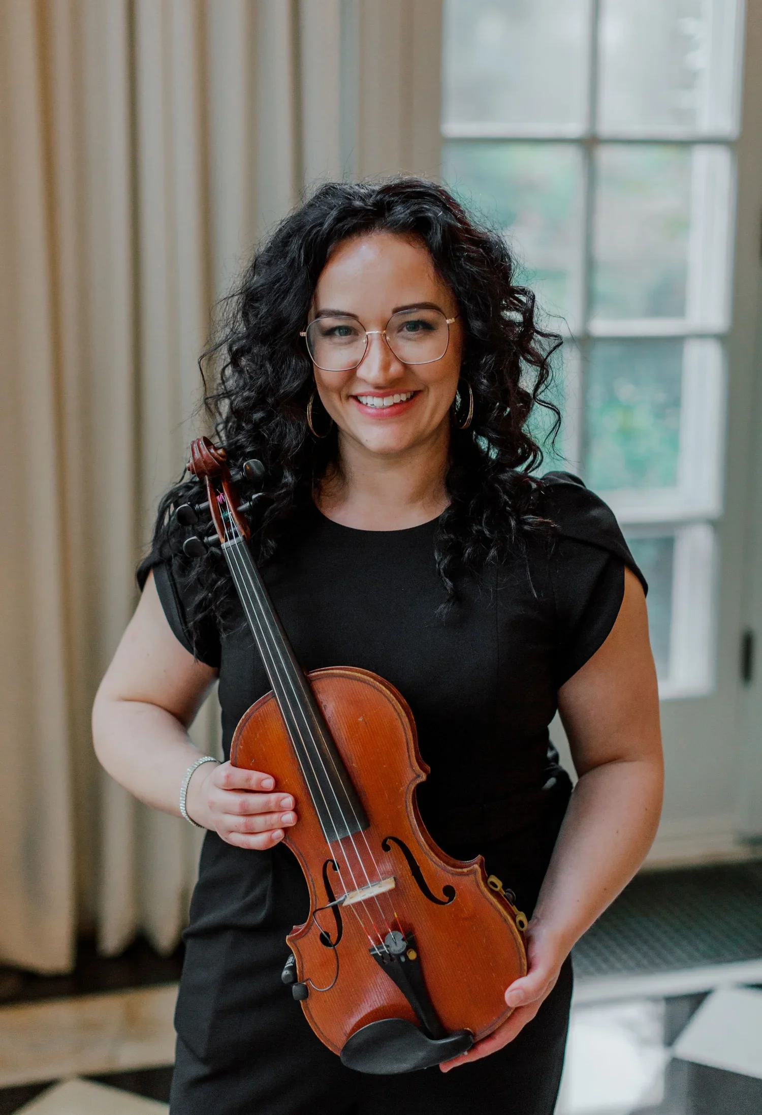April, Owner, violinist & pianist