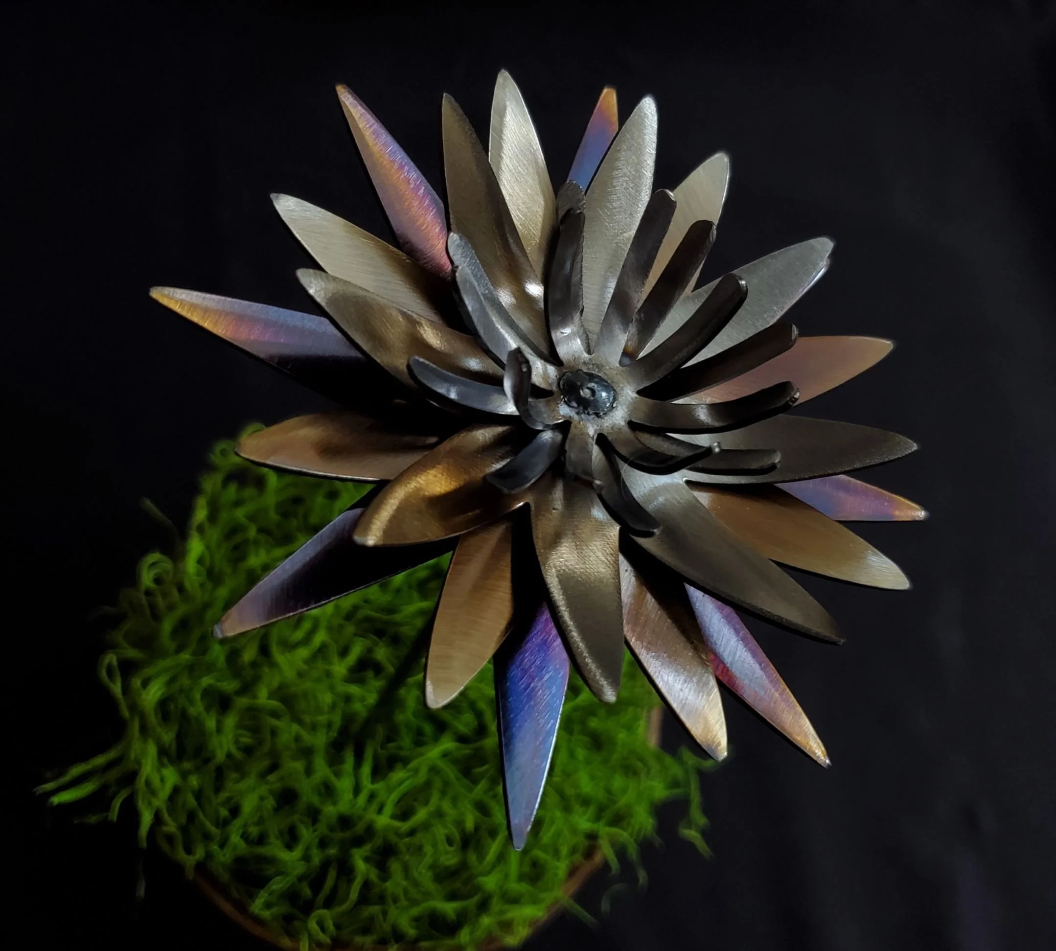 Metal steel three-dimensional flower decoration with color from heat treating by METALgarden for the garden or a flowerpot