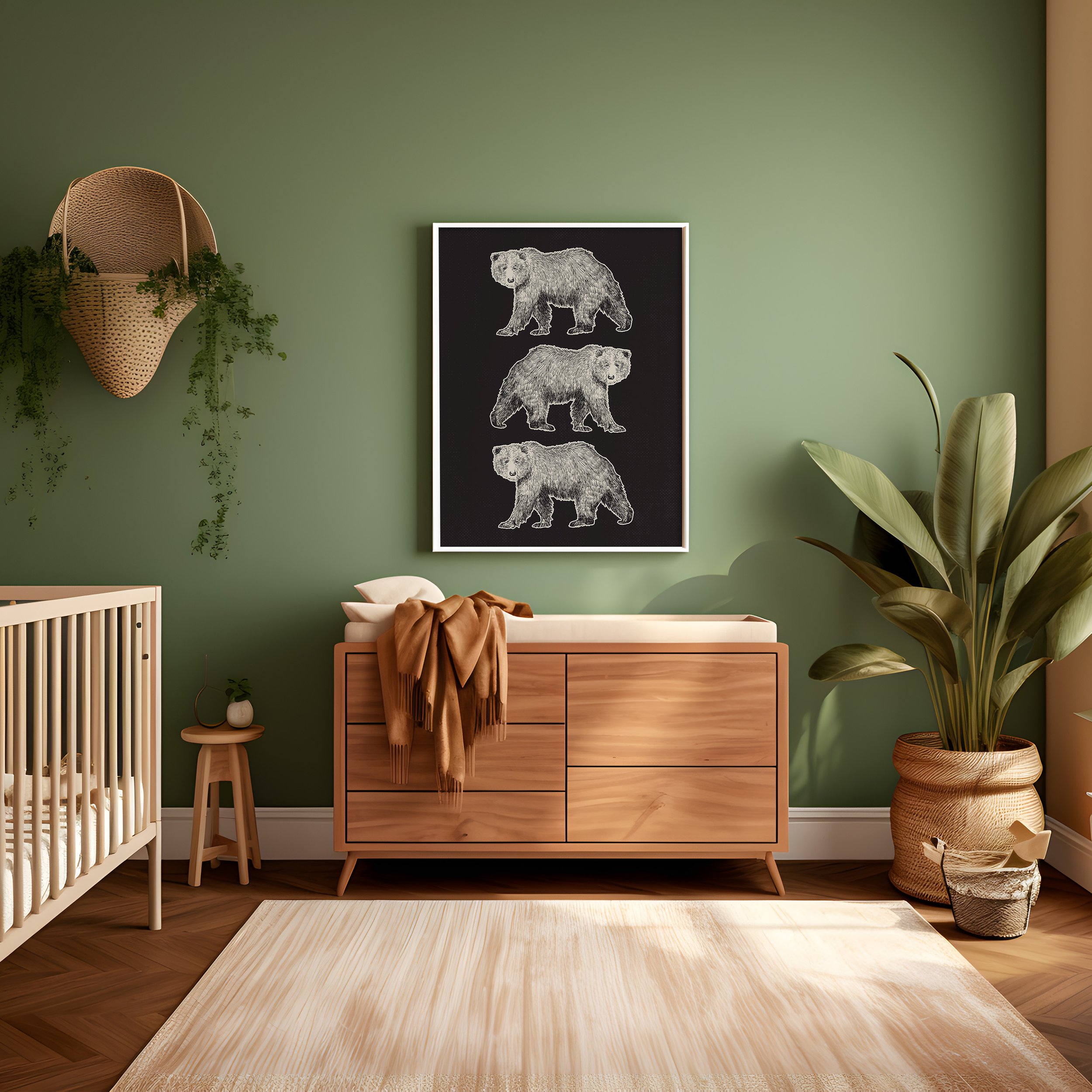 Modern baby nursery with a green wall, wooden dresser with changing pad, framed black and white art of three bears, large potted plant, hanging woven basket with greenery, small wooden stool with decorative item, and beige rug.