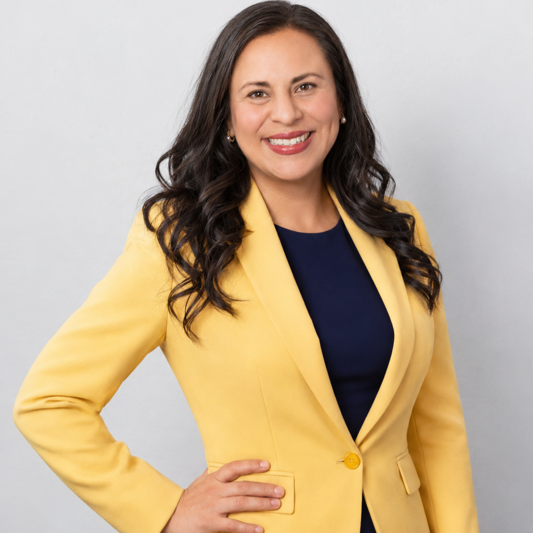 Patty Munoz, LMFT, a Rancho Cucamonga counseling therapist specializing in anxiety, trauma, and burnout for Latina women, wearing a yellow jacket and smiling warmly.