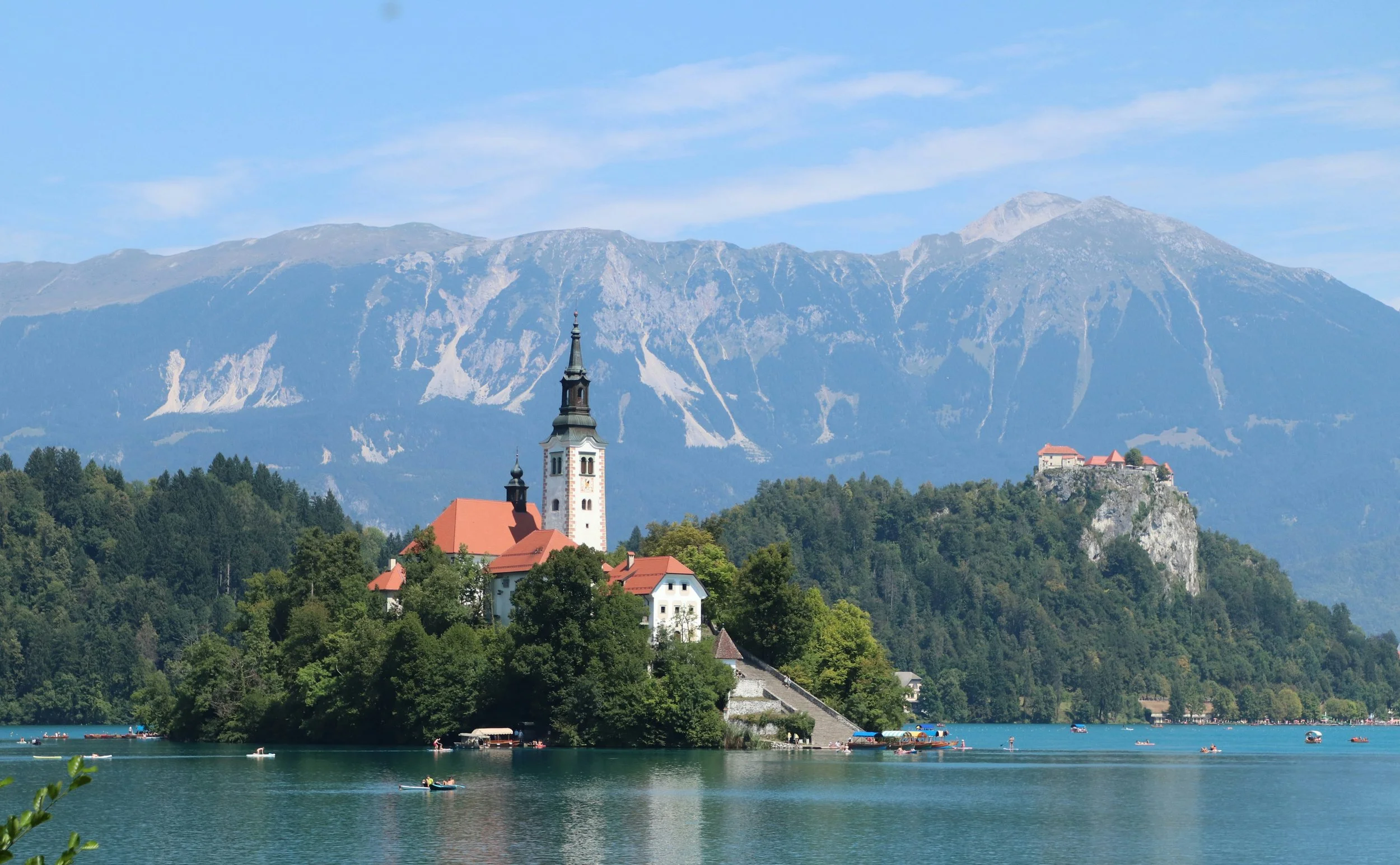 Lake Bled island with its church and castle framed by the Julian Alps.