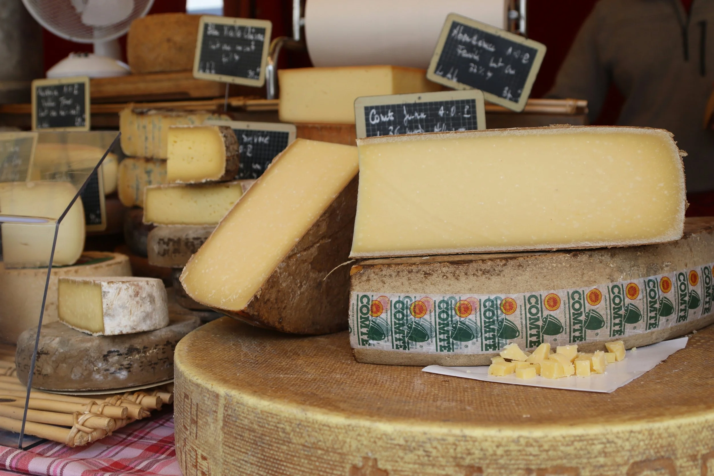 Selection of regional cheeses displayed at a local market during the Alsace food tour.