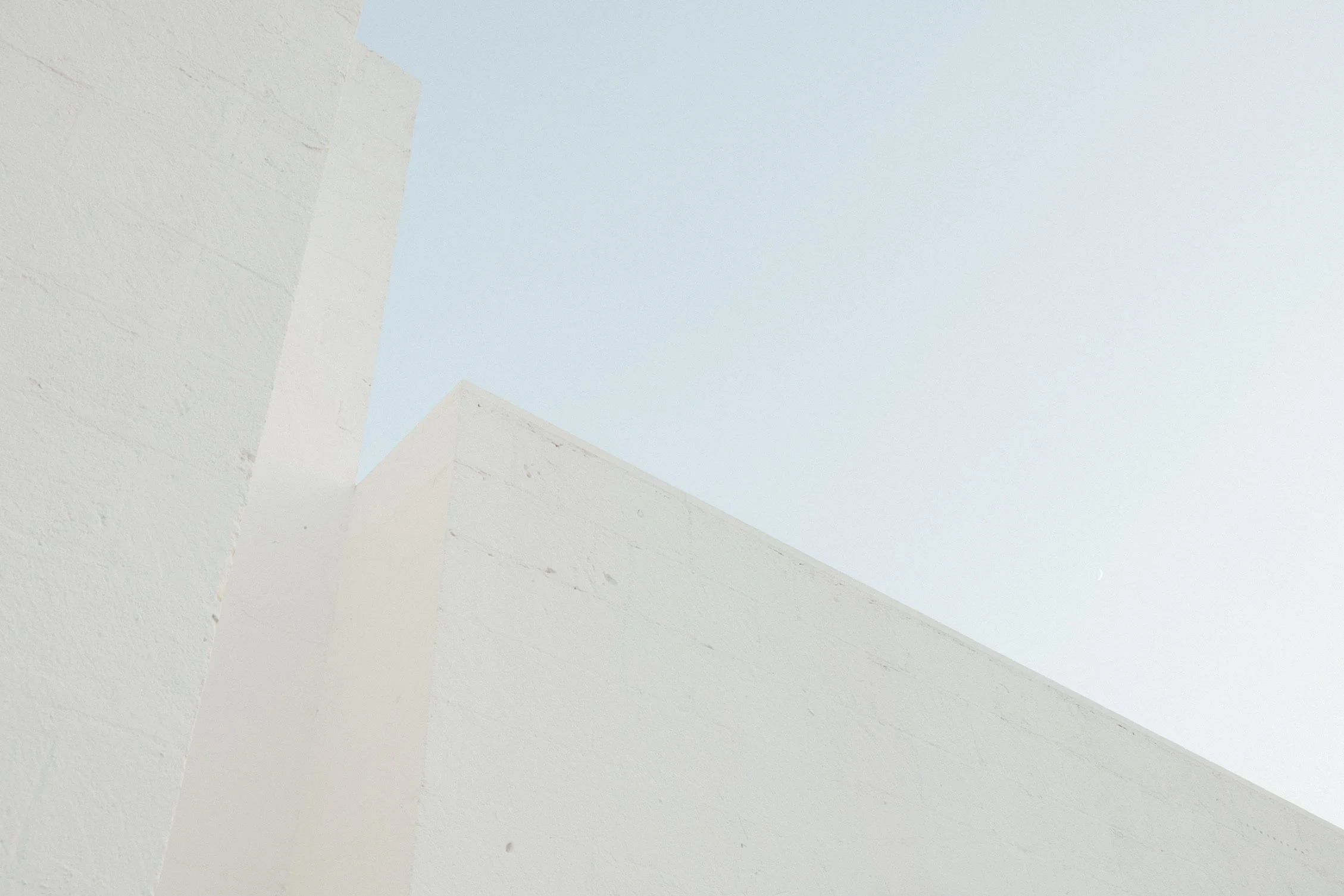 a tall building against the sky with simple lines and strong structure