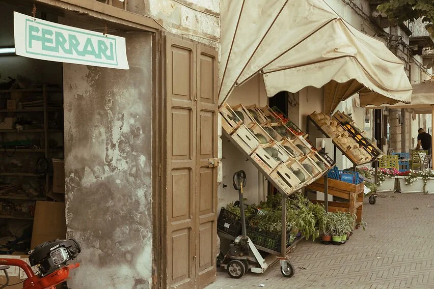 warm tones of farmers market with produce and a vintage motorbike showing culinary process