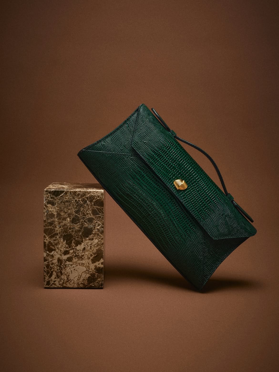The texture of the season.  Shop the Cassandra Clutch in Lizard, handcrafted in Italy..jpg