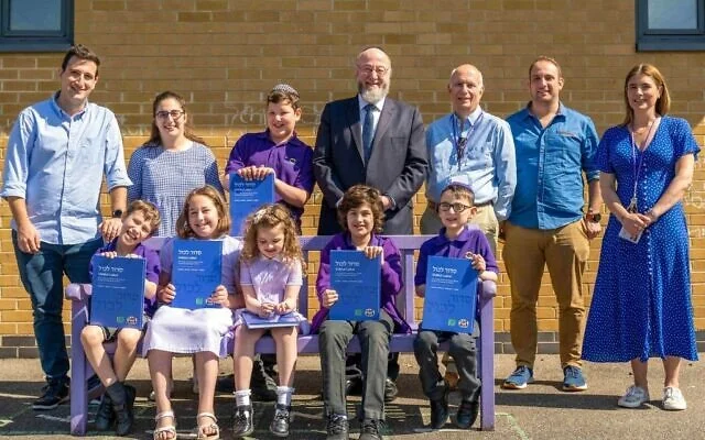 A crowd of excited primary school students have become the first to receive a unique prayer book, the Siddur Lakol, or “Siddur for Everyone”, designed to be used by people with learning disabilities.