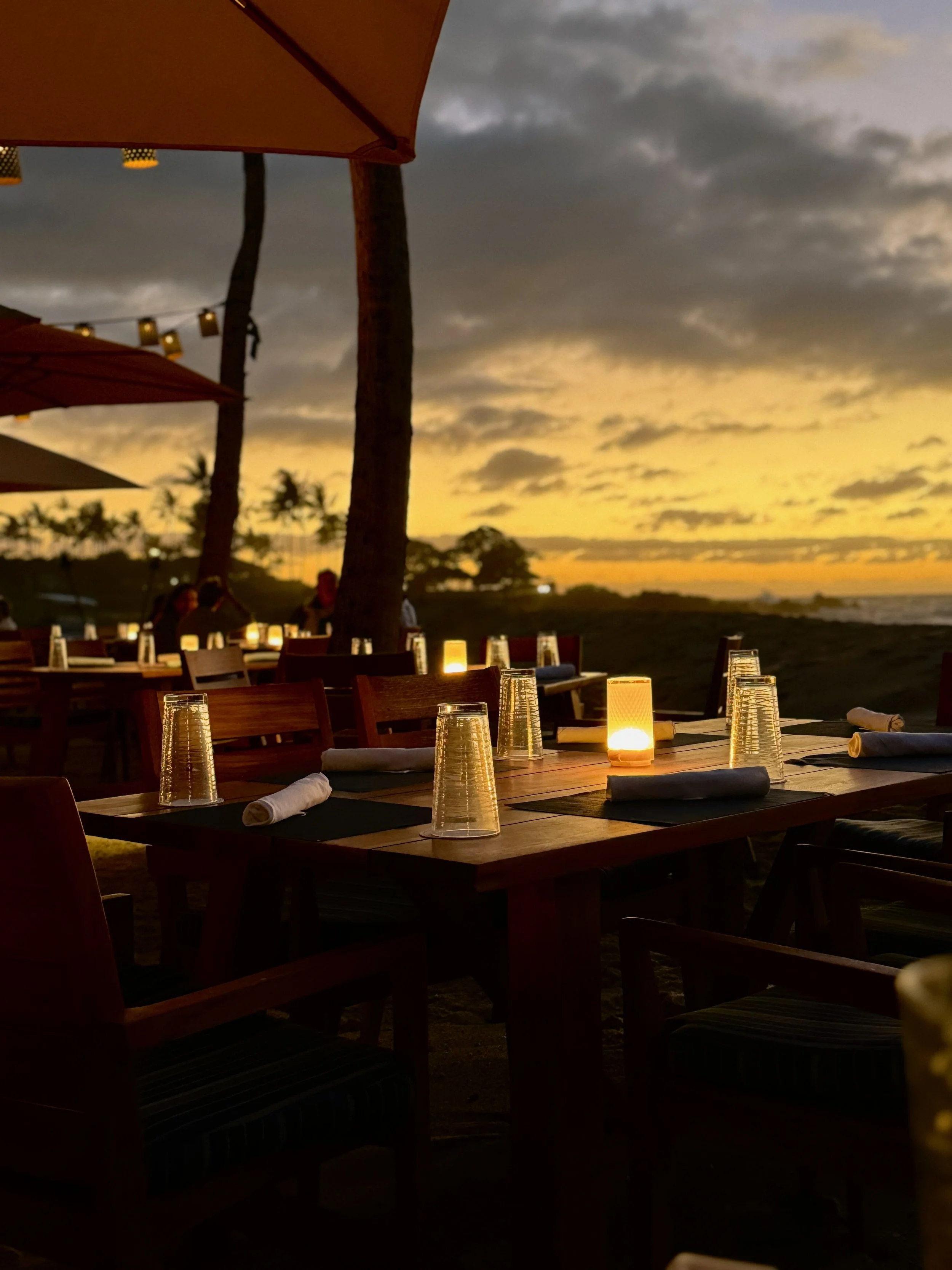 a photograph of a sunset beach meal in Lanai, Hawaii