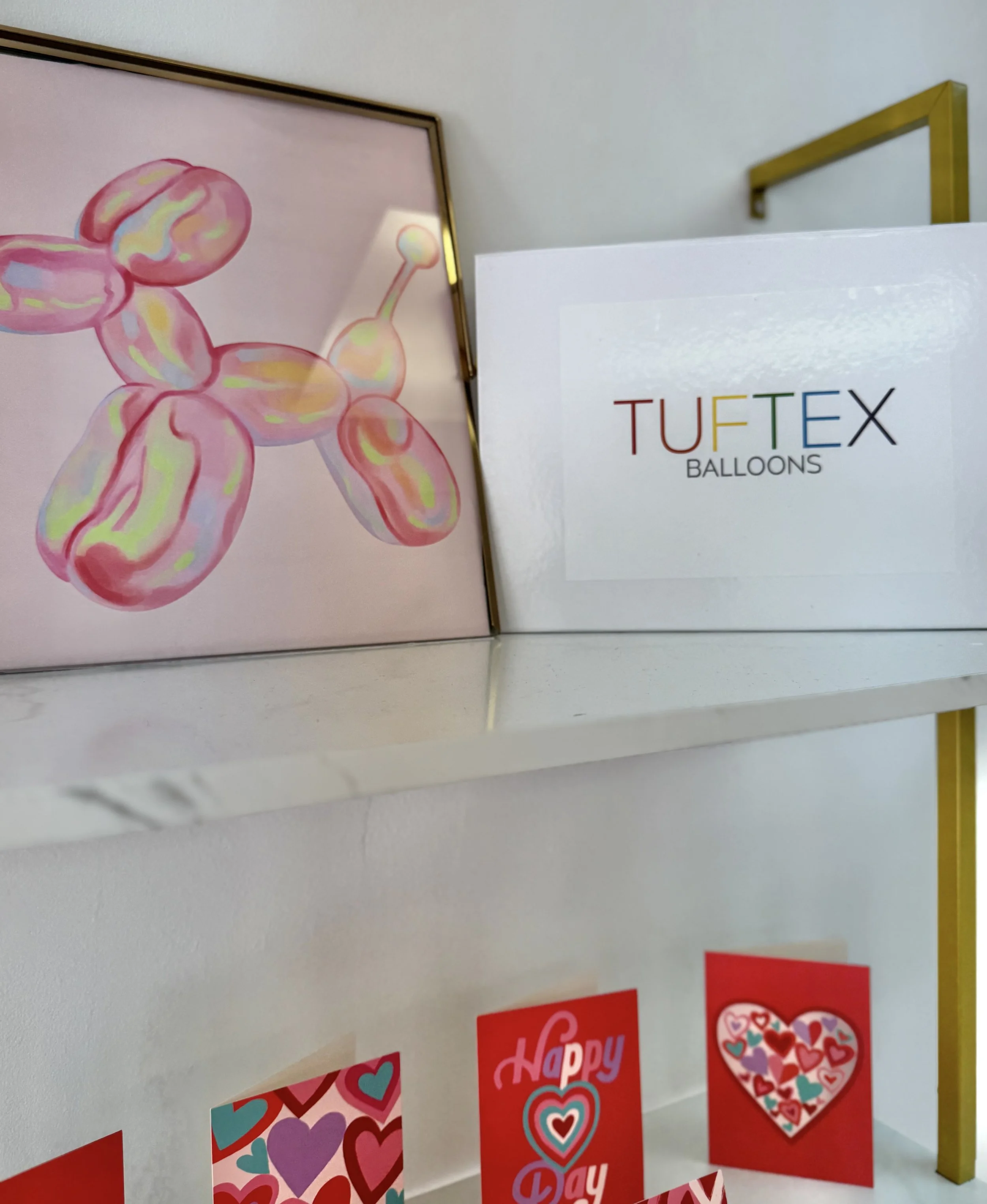 Colorful balloon animal illustration and Valentine’s Day cards with hearts and love-themed designs.