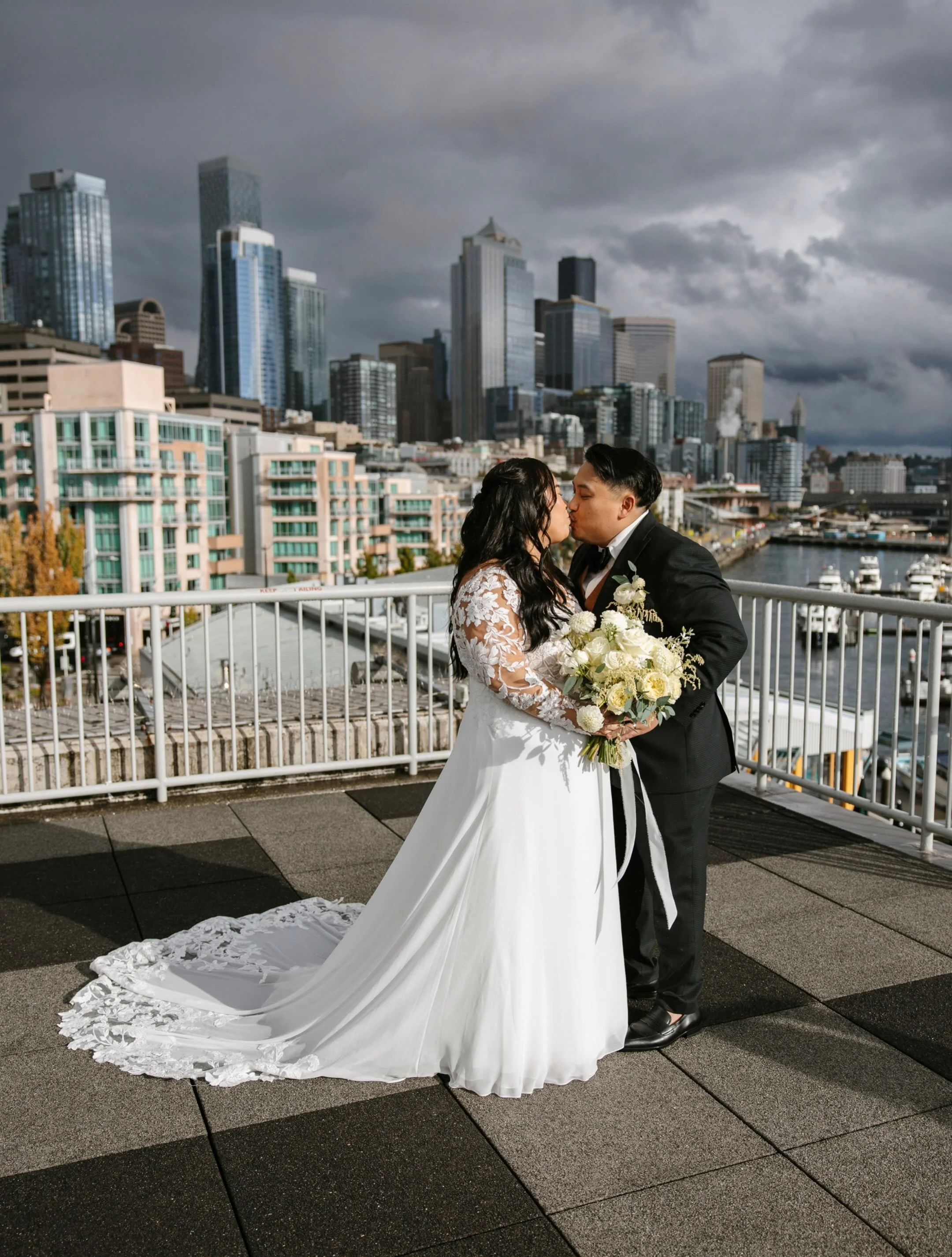 This moment was captured right as the sunlight broke through after hours of rain this past weekend. It made for an epic skyline shot for Angie and Luka&rsquo;s wedding day at the Bell Harbor rooftop in Seattle. Crazy skies and incredible light.

The 
