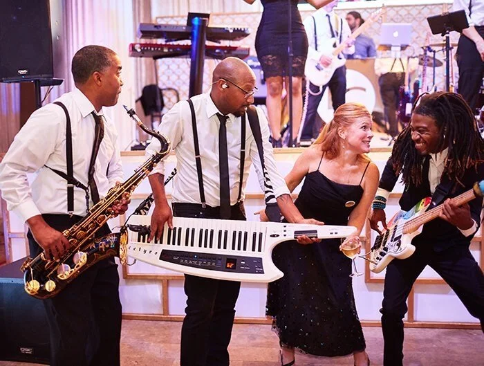  Band members down on the floor at the Weddings in Houston 30th Anniversary Celebration at The Corinthian  Photo by Civic Photos 