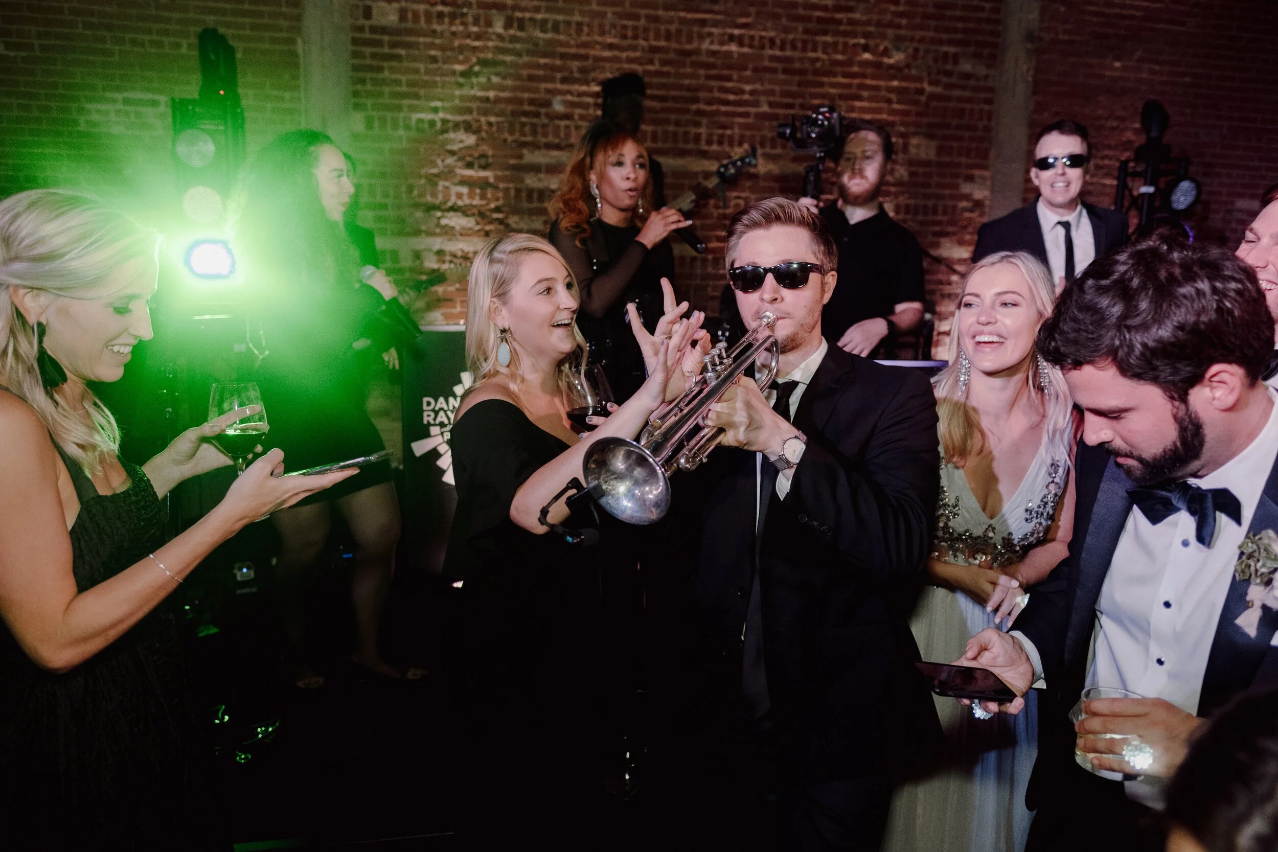  Sure, you can play Kelby’s trumpet.  Photo by Shy Laurel Photography at Hotel Emma 