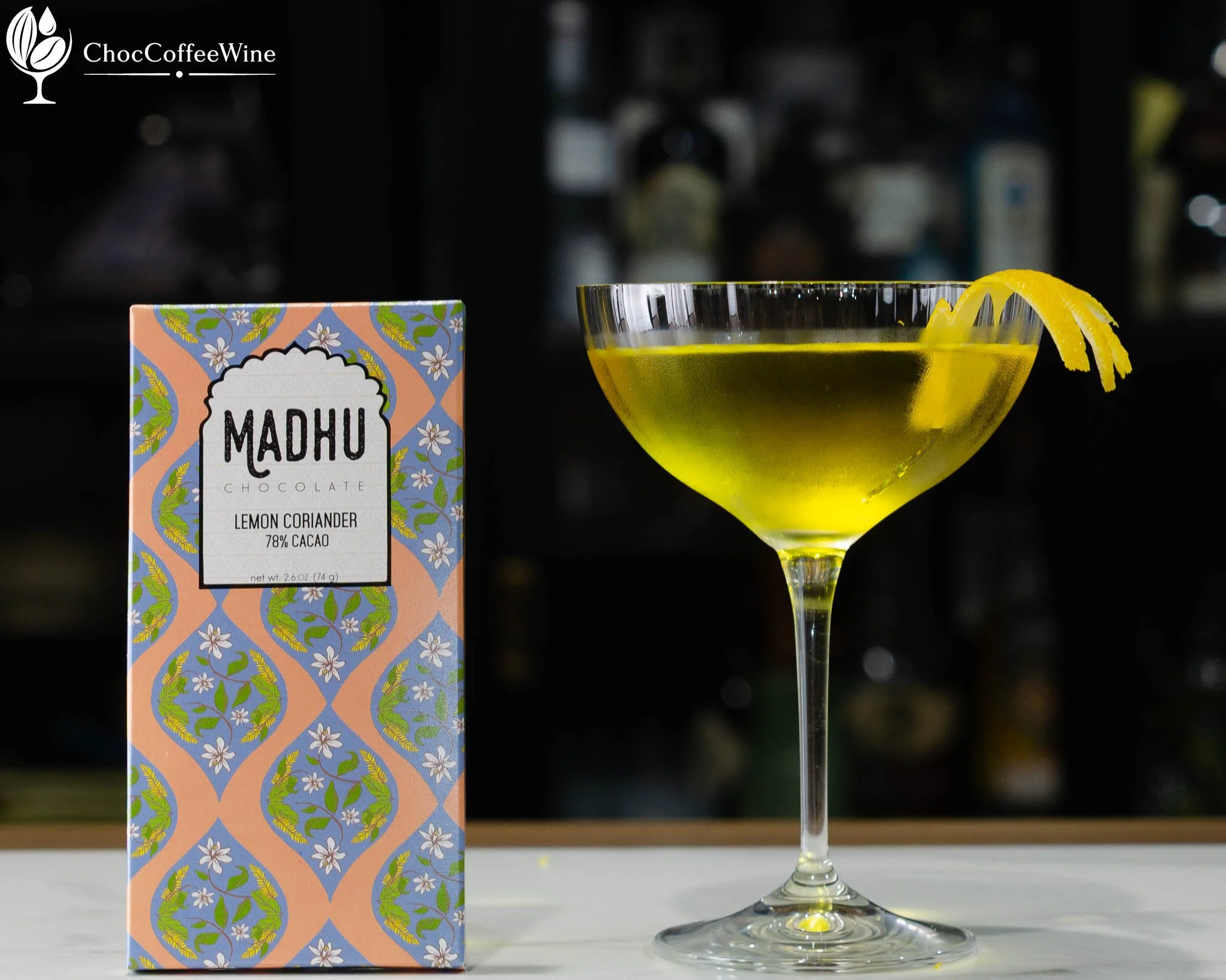 White Negroni made with Malfy Gin, Suze and Lillet Blanc garnished with lemon peel paired with lemon coriander chocolate from Madhu