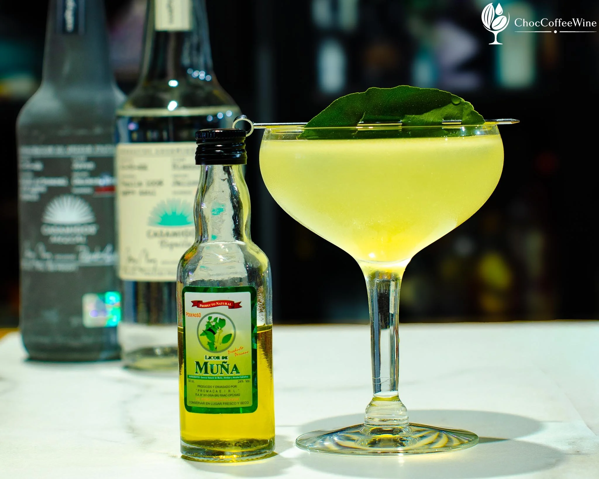 Muña Magic cocktail made with mezcal, silver tequila, sweet lime and muña liqueur in a coupe glass