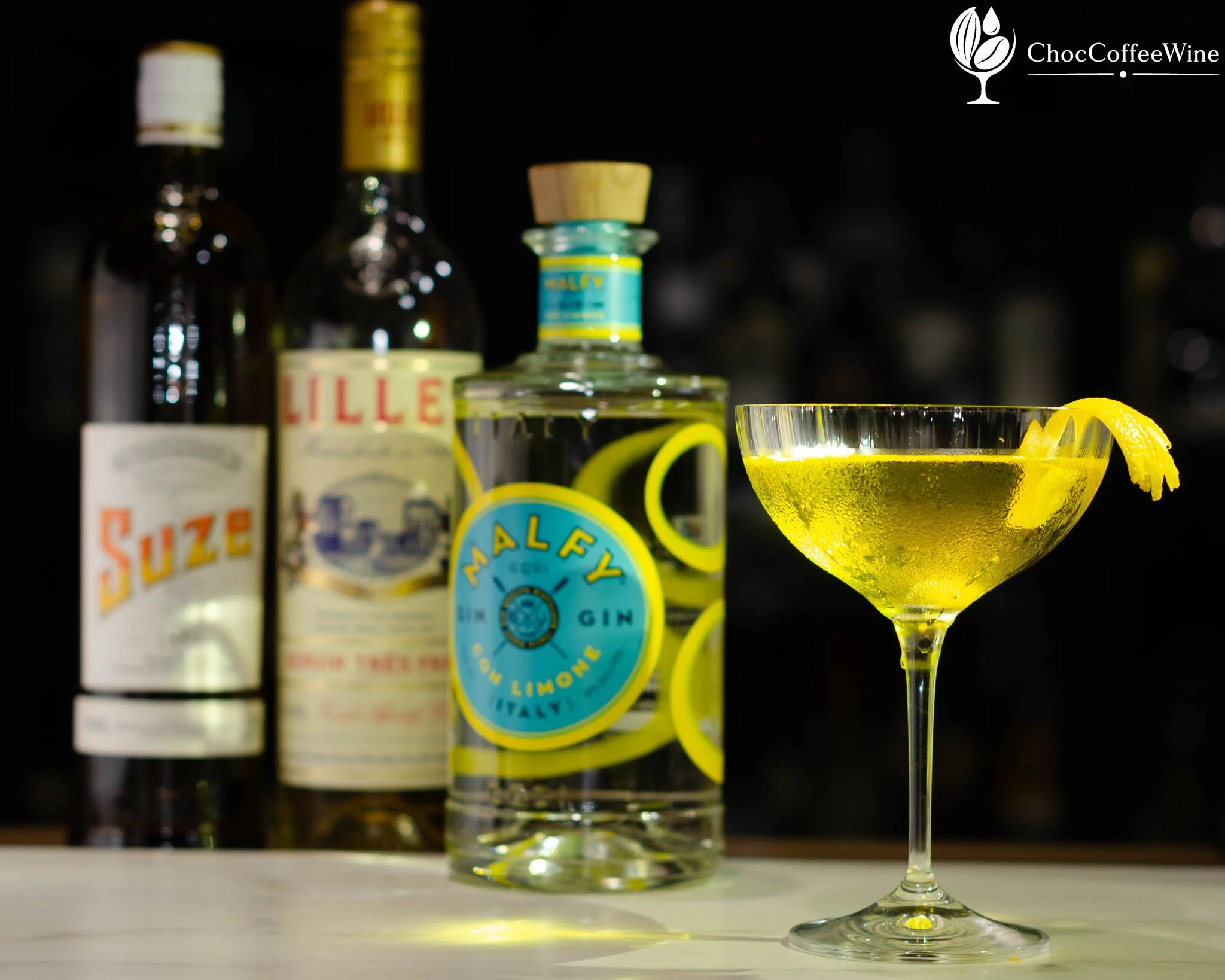 White Negroni made with Malfy Gin, Suze and Lillet Blanc garnished with lemon peel