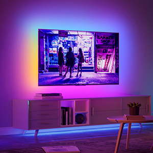 Modern living room with wall-mounted TV displaying a neon-lit street scene, ambient lighting, and minimalist furniture.