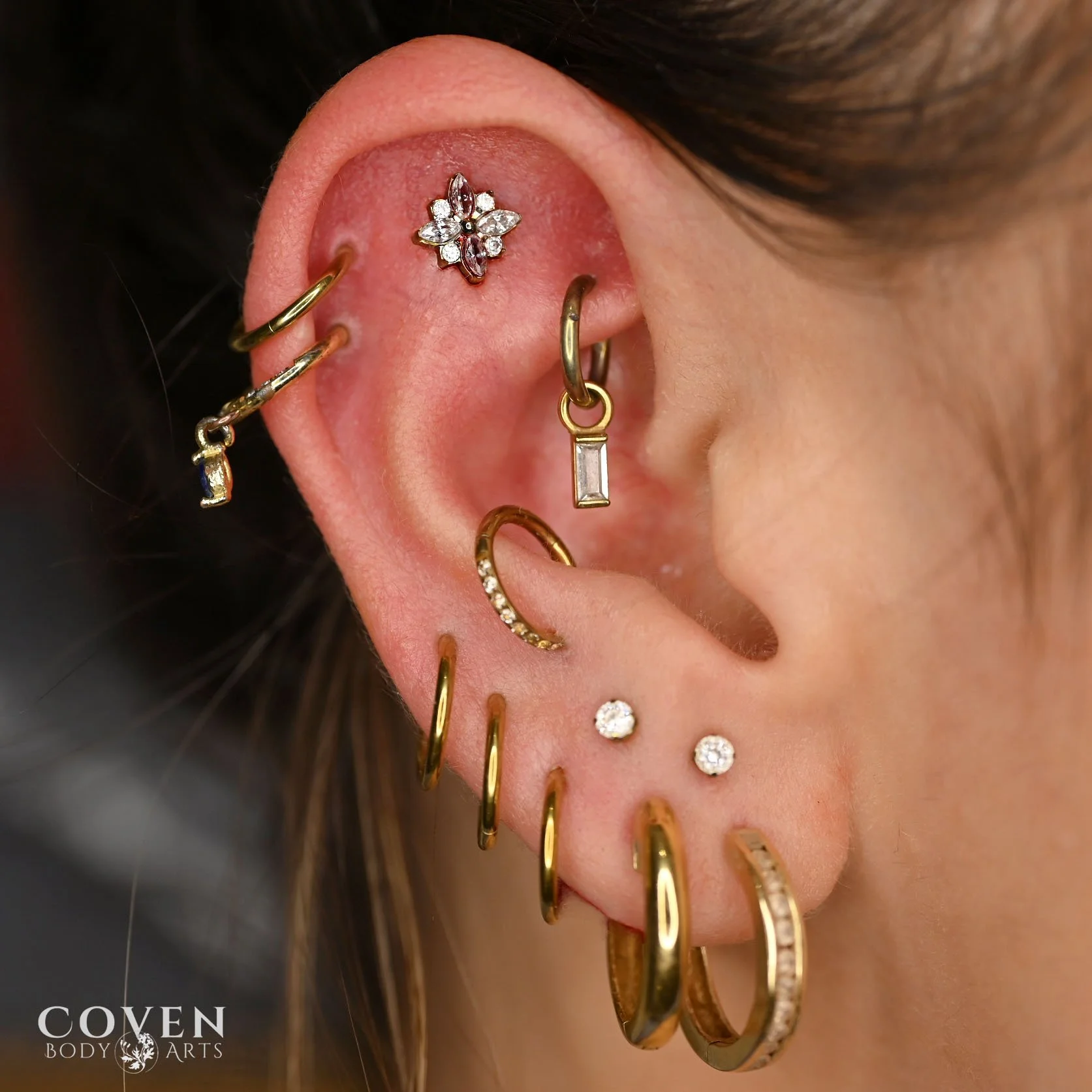 curated titanium ear, titanium anodized gold, ear piercings, flat piercing, calgary body piercing, stacked lobes, earlobe piercings