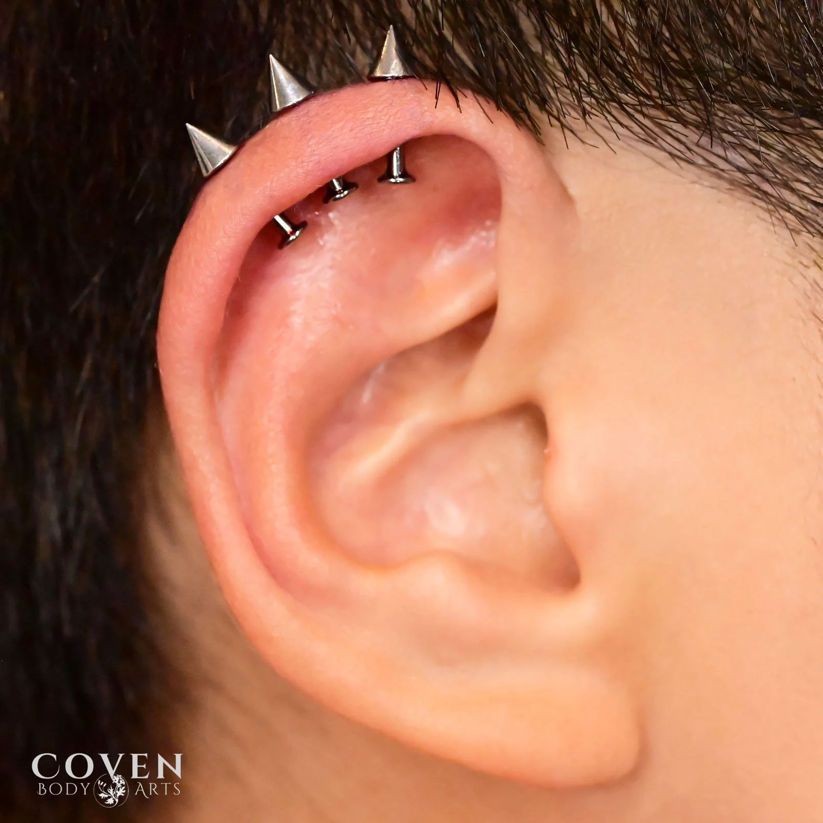 triple helix, ear piercings, ear piercing, spiked  ear piercings, spiked jewelry, titanium, titanium jewelry, threadless jewelry, body piercings, body piercing, calgary, calgary body piercing, calgary piercing, vertical helix piercing 