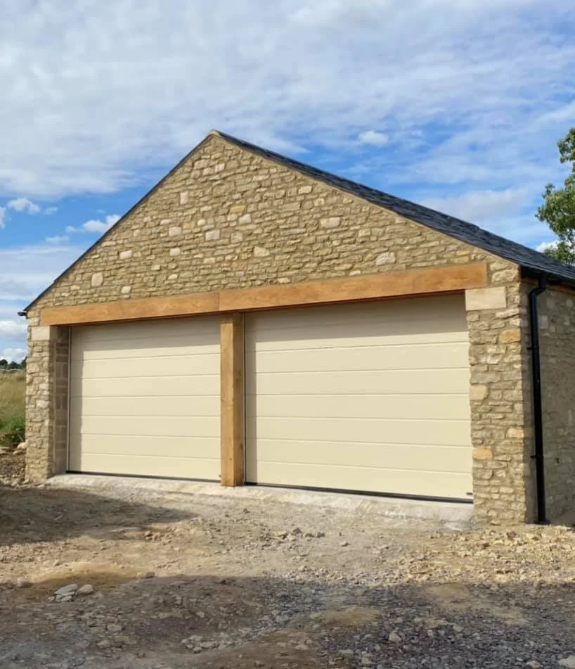 Cotswold stone double garage with oak frame and eletric roller roors