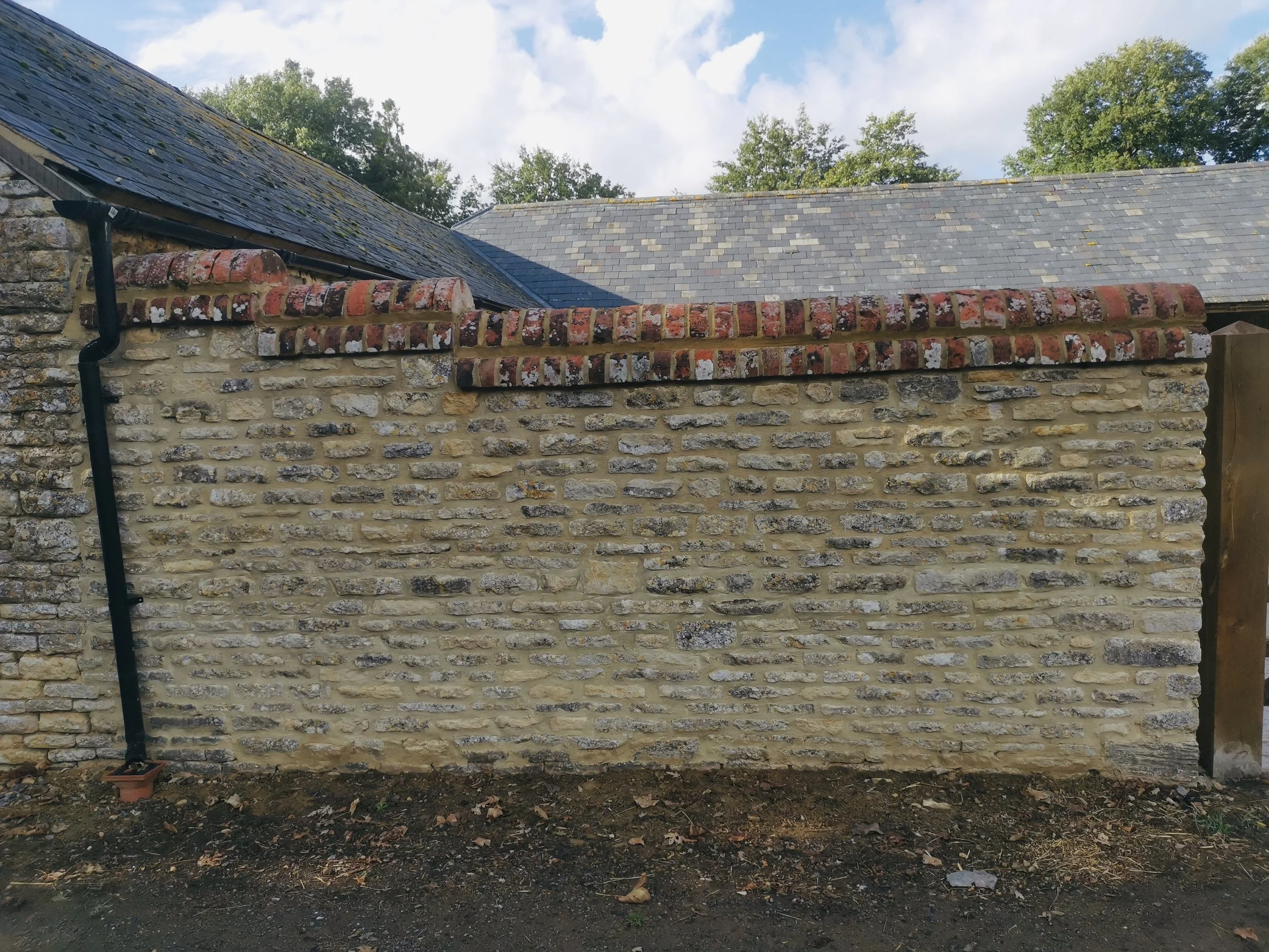 Natural stone wall repair and repointing in Leafield, Witney