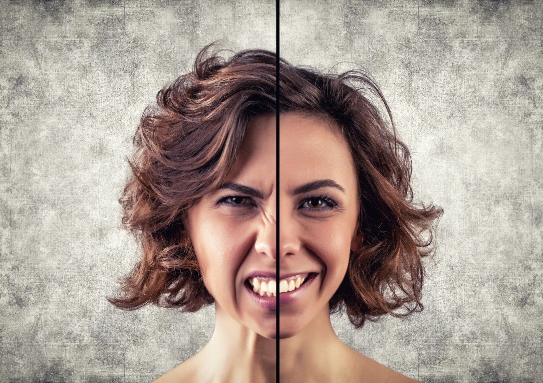 split image of a woman's face, left side expressing anger and the right side joy