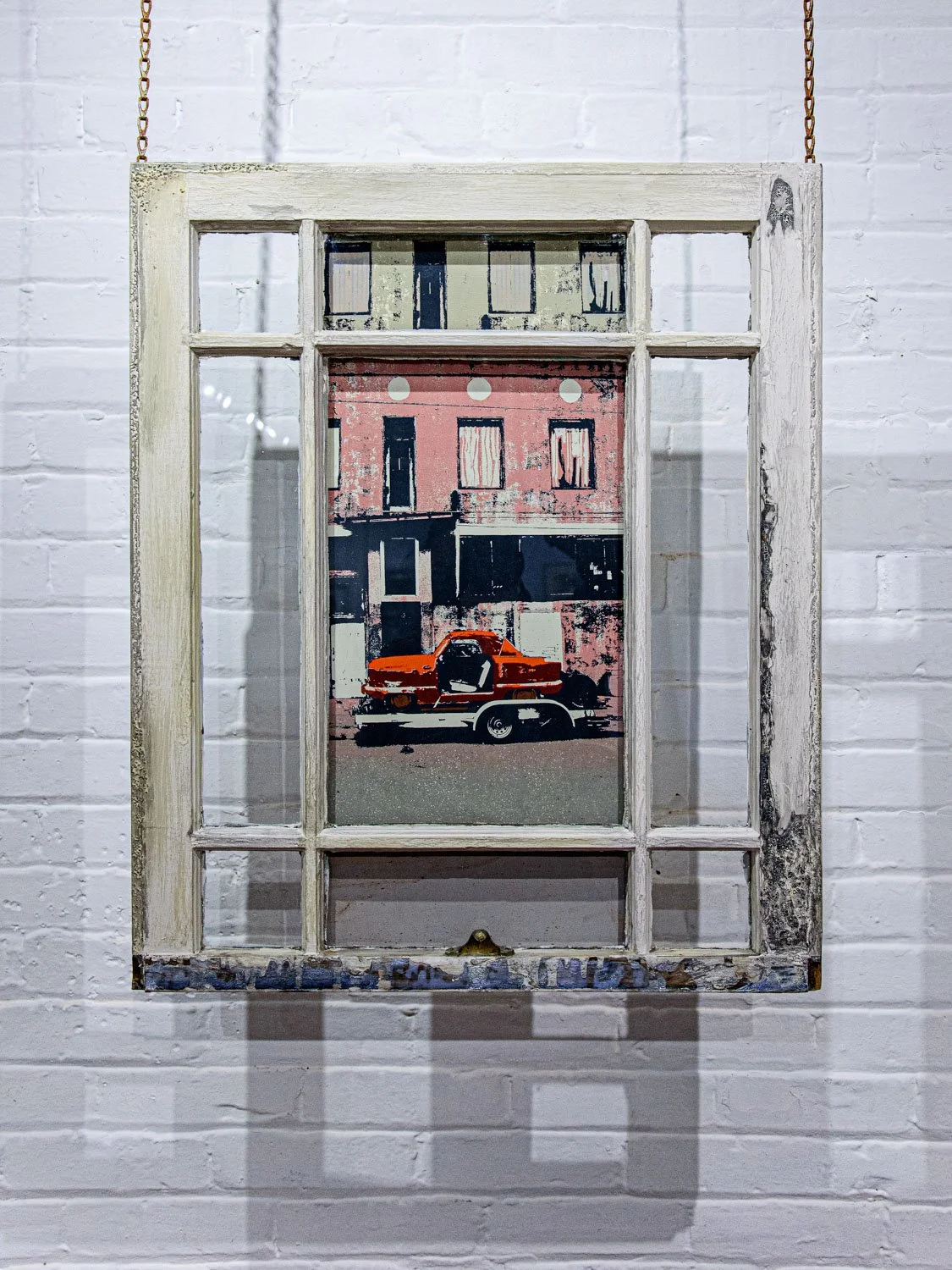 Repurposed window with a fine art screenprint containing an image of a burned out car, by Karen Beckwith.